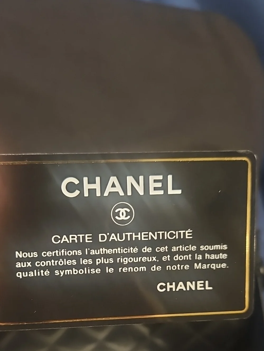 CHANEL Black Quilted Leather Clutch with CC Logo